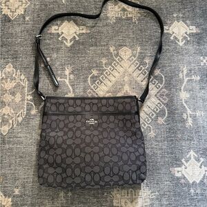 Coach Black Leather Crossbody Bag with Embossed Logo